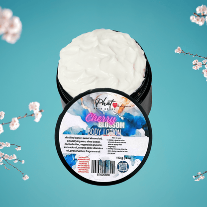 Body lotion container labeled 'Cherry Blossom' with cherry blossom branches on a teal background