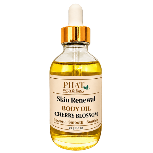 Phat Bath & Body Cherry Blossom Skin Renewal Body Oil, 3.5 oz golden body oil in a clear glass dropper bottle with a gold cap and cream label.