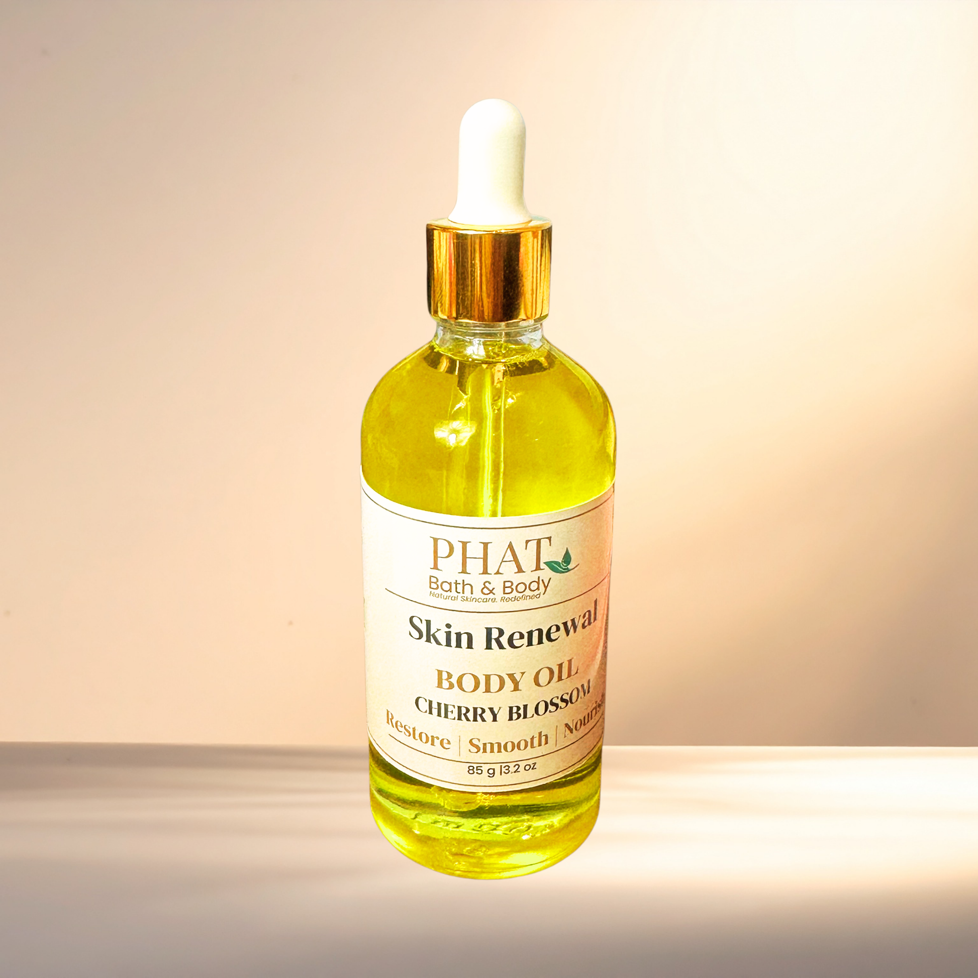 Bottle of PHAT Bath & Body Skin Renewal Body Oil on a gradient background