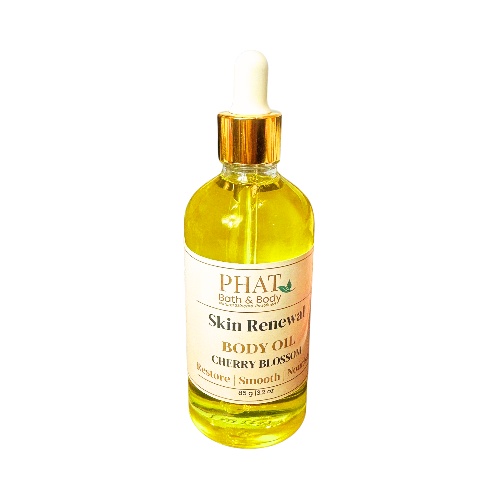 Bottle of Phat Bath & Body Skin Renewal Body Oil with cherry blossom scent on a white background
