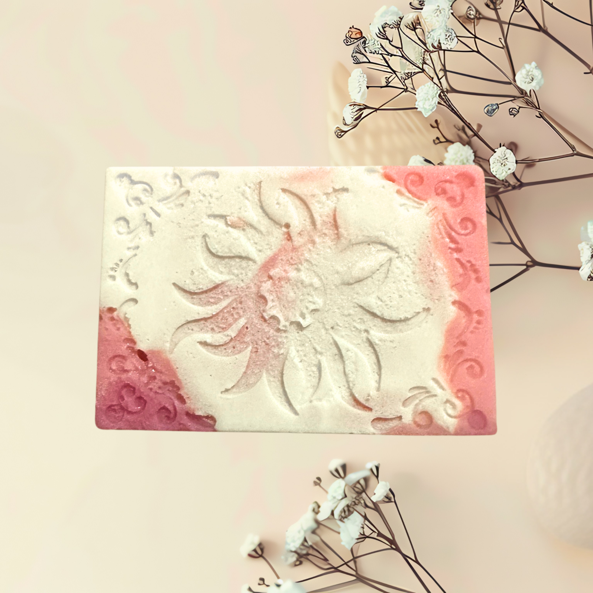 Decorative soap bar with floral design on a light background
