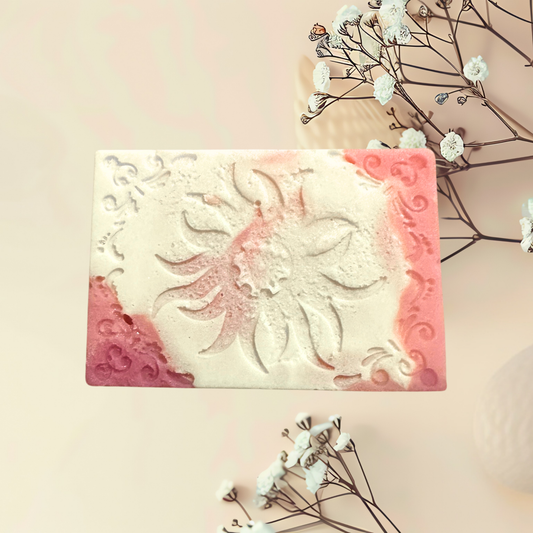 Decorative soap bar with floral design on a light background