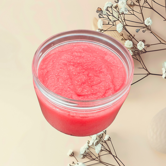 Pink scrub in a jar with white flowers on a beige background