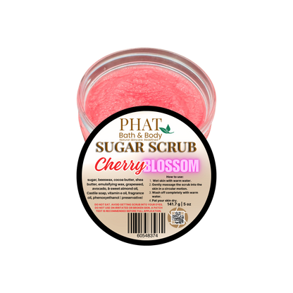 Jar of cherry blossom sugar scrub with a label on a white background