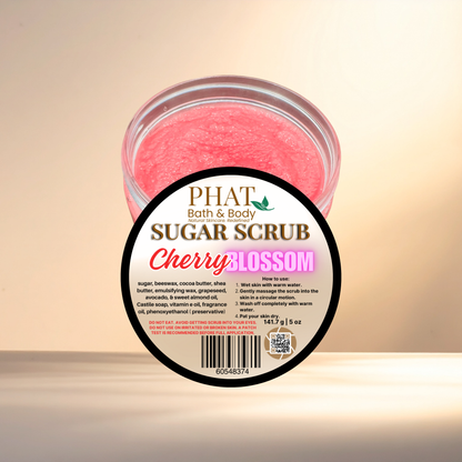 Jar of cherry blossom sugar scrub with a visible label on a light background