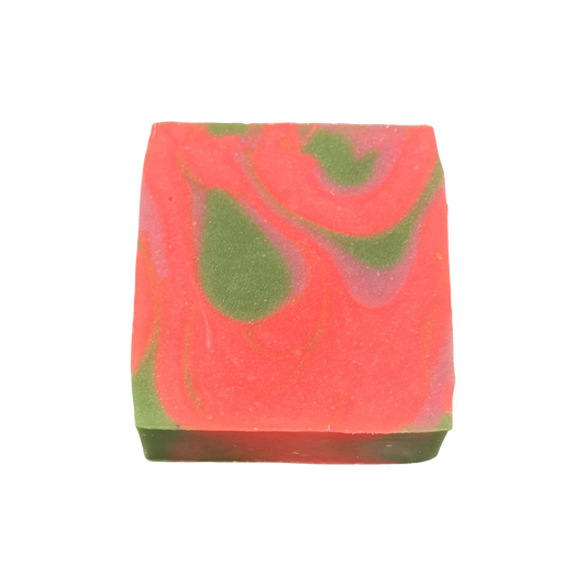 Colorful soap bar with pink and green swirls on a white background
