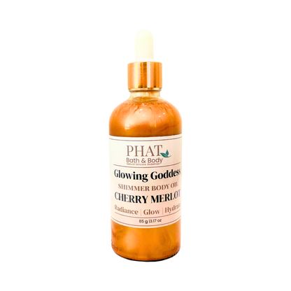 Bottle of 'Glowing Goddess' shimmer body oil by Phat Bath & Body on a white background