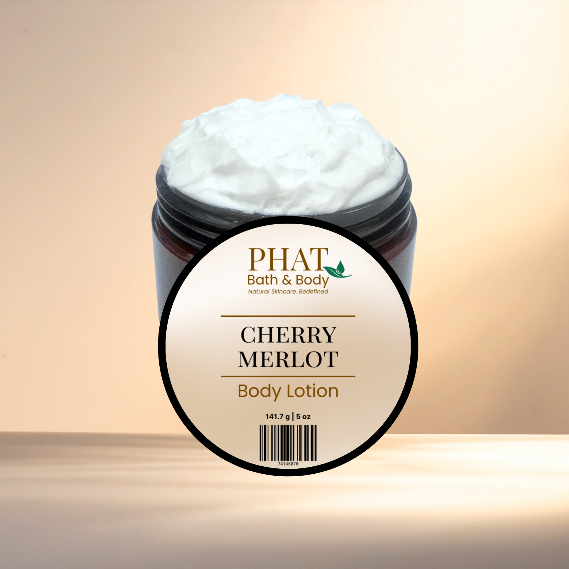 Jar of cherry merlot body lotion with 'Phat Bath & Body' label on a gradient background