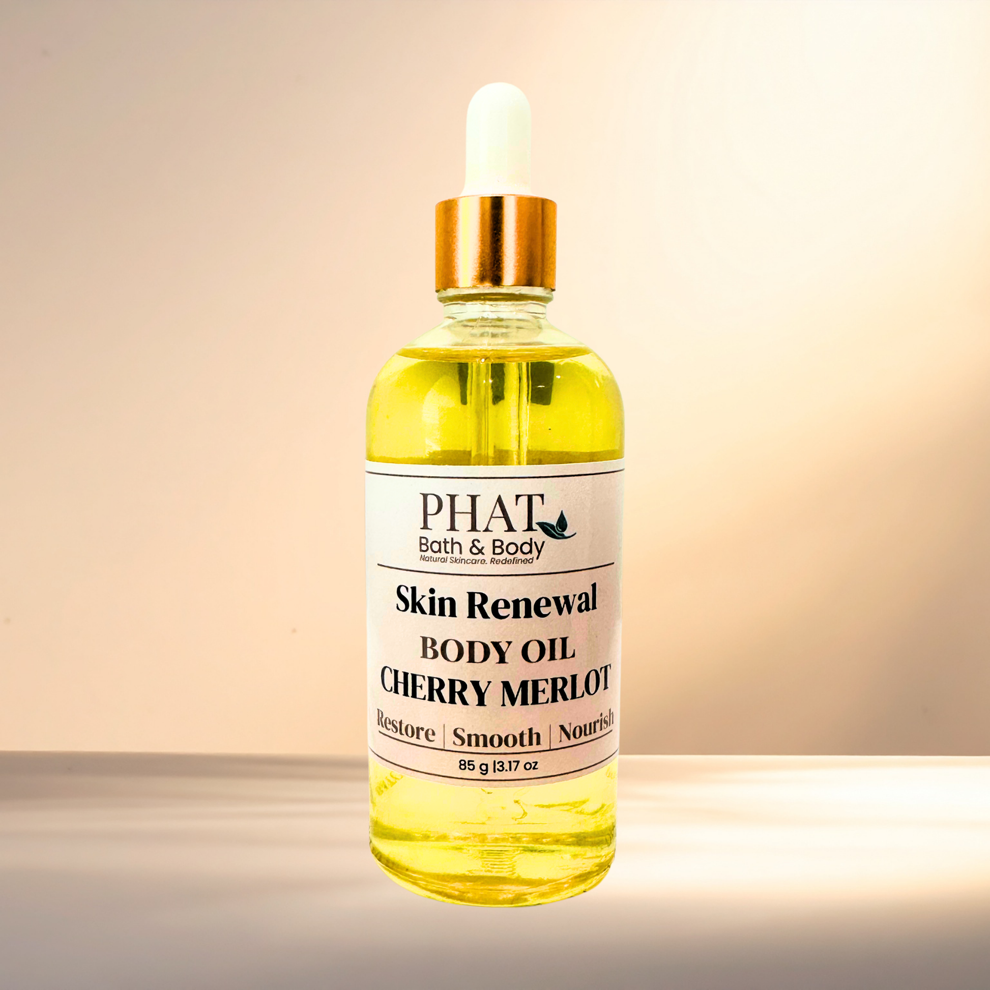 Bottle of Phat Bath & Body Skin Renewal Body Oil Cherry Merlot on a gradient background