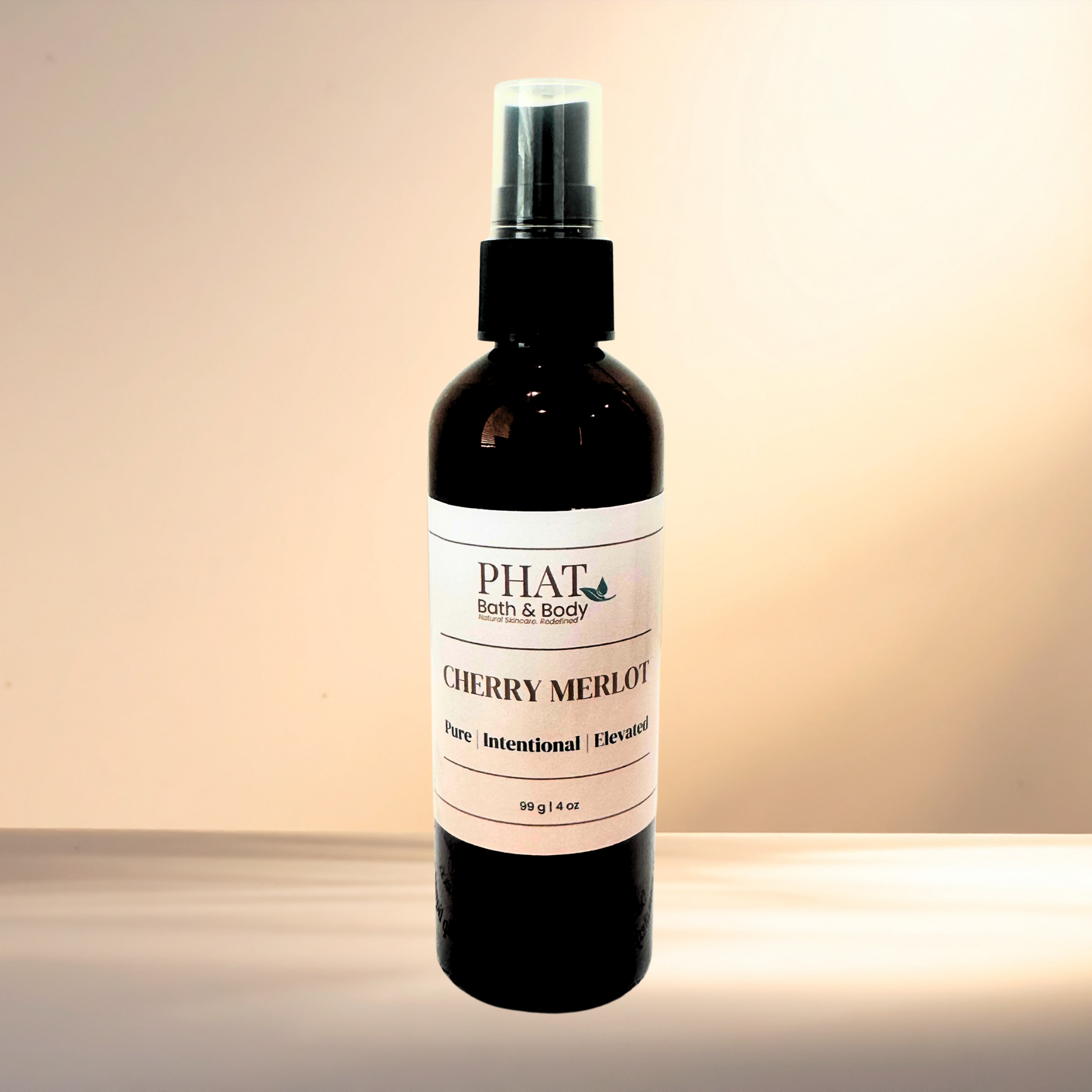 Bottle of 'Cherry Merlot' by PHAT Bath & Body on a gradient background
