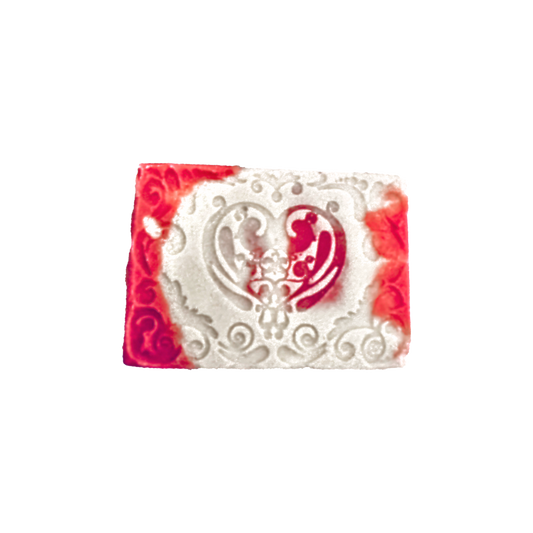 Decorative soap bar with red and white design on a white background