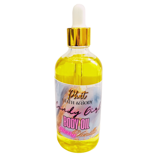 Bottle of body oil with a dropper labeled 'Phat Bath & Body Candy Girl' on a white background