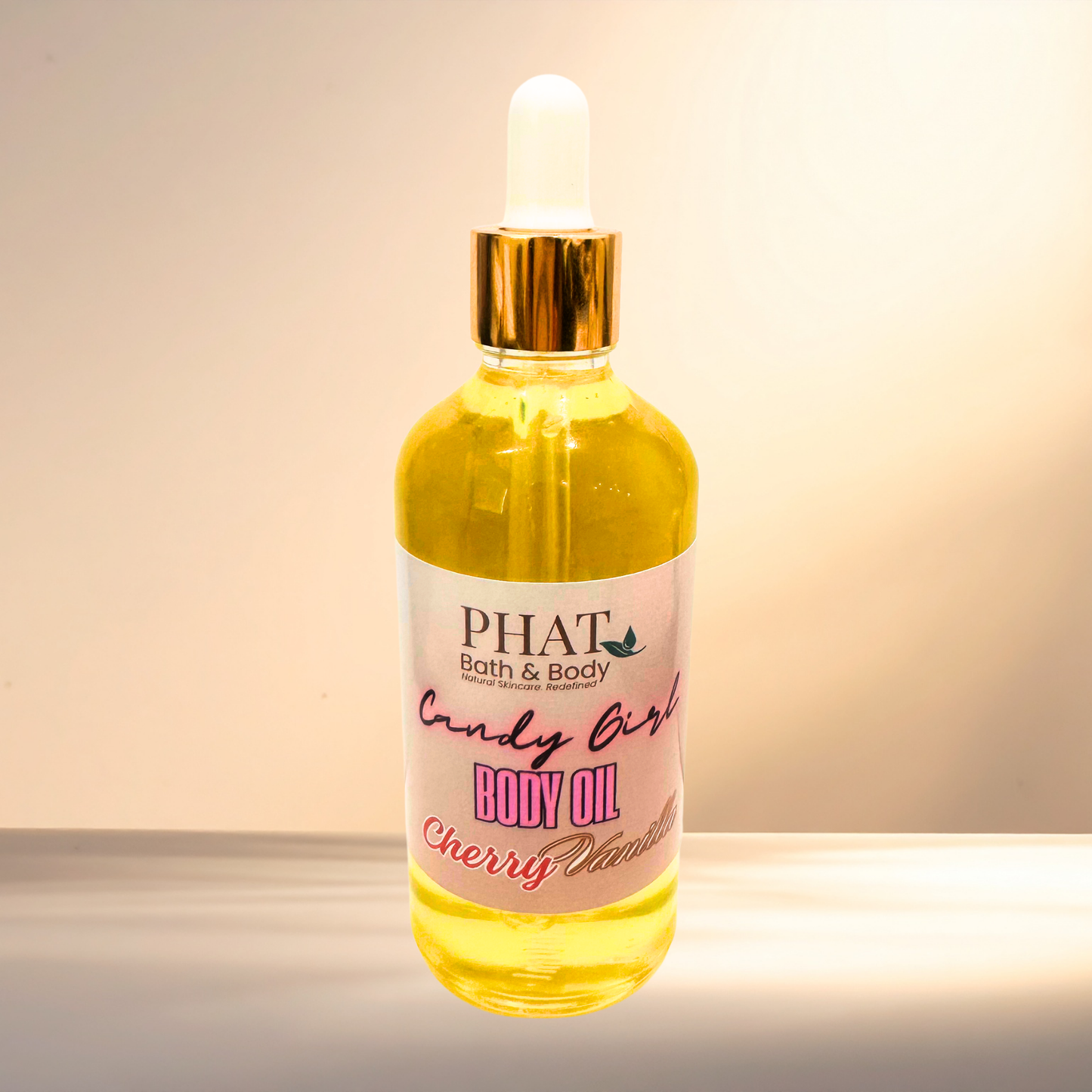 Bottle of 'Candy Girl' body oil with a dropper on a gradient background