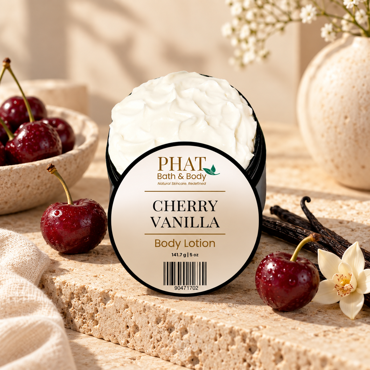 Phat Bath & Body Cherry Vanilla Body Lotion styled with ripe cherries, vanilla beans, white florals, soft neutral fabric, and warm natural stone.