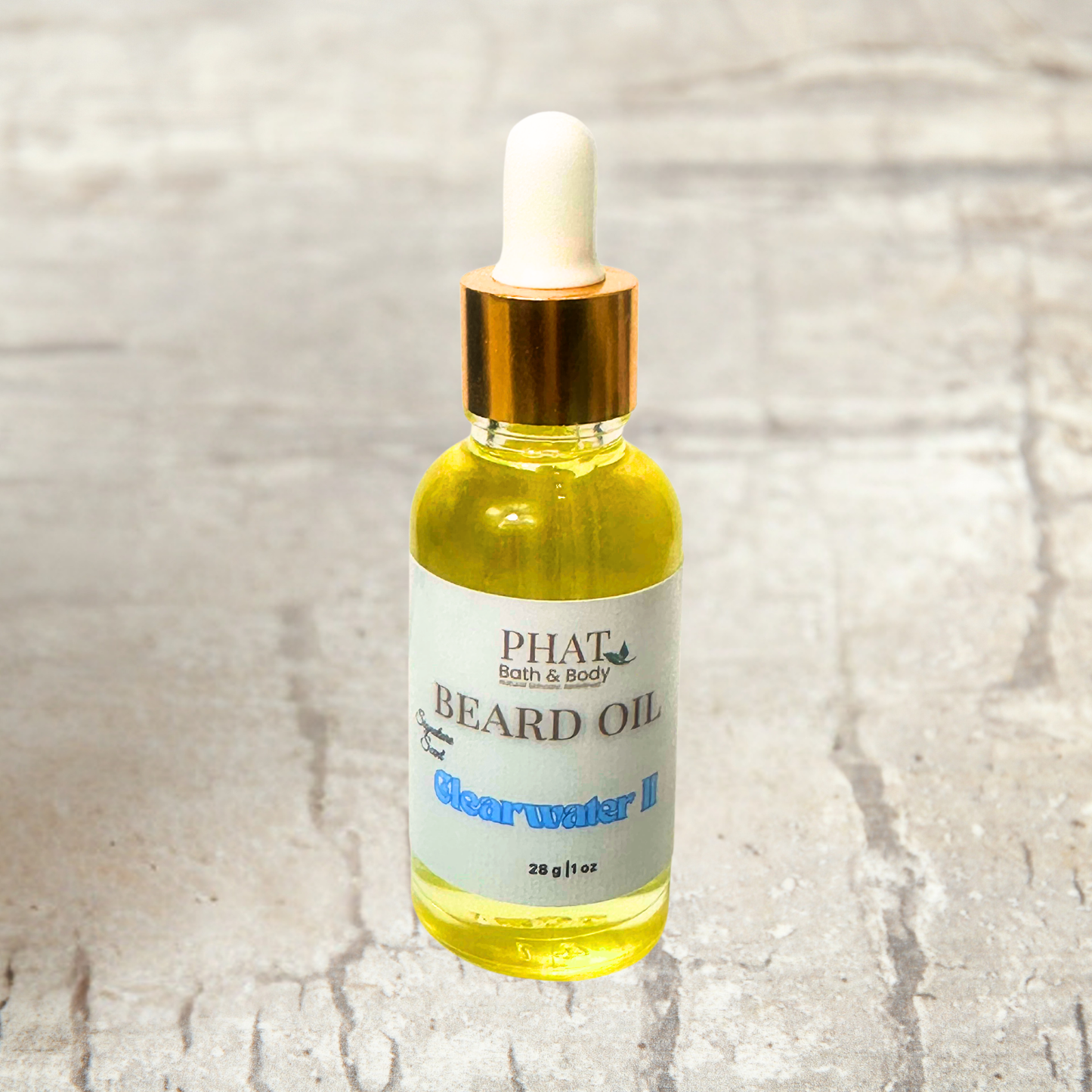 Bottle of Phat Bath & Body beard oil on a textured surface