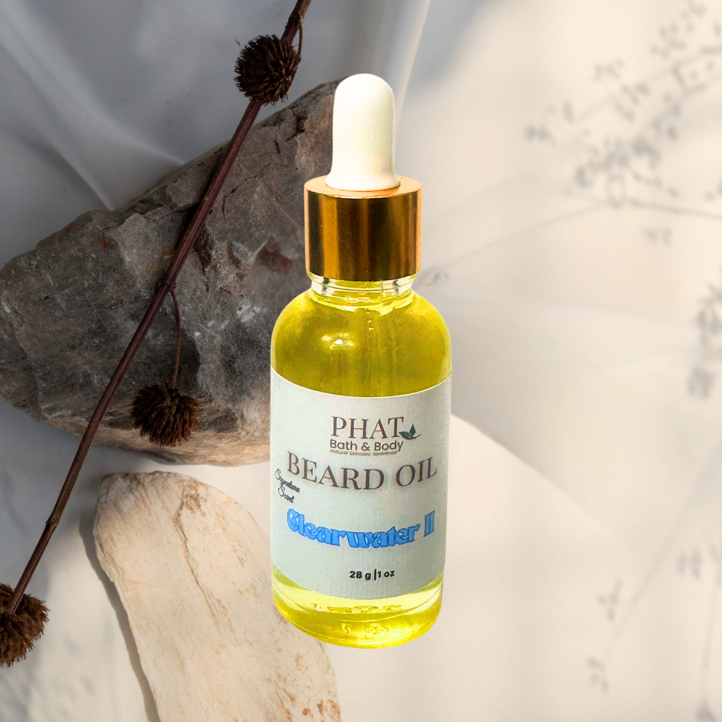 Bottle of Phat Bath & Body beard oil with a dropper on a neutral background