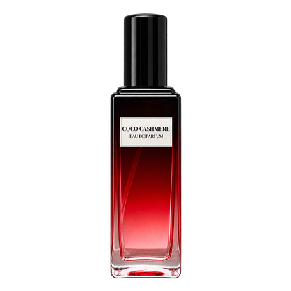 Phat Bath & Body Coco Cashmere Eau de Parfum in a tall clear glass perfume bottle with black cap, warm tan label, and deep red-toned fragrance, shown as the main product image.