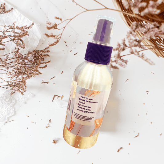 Body spray with directions label on a light background with dried flowers