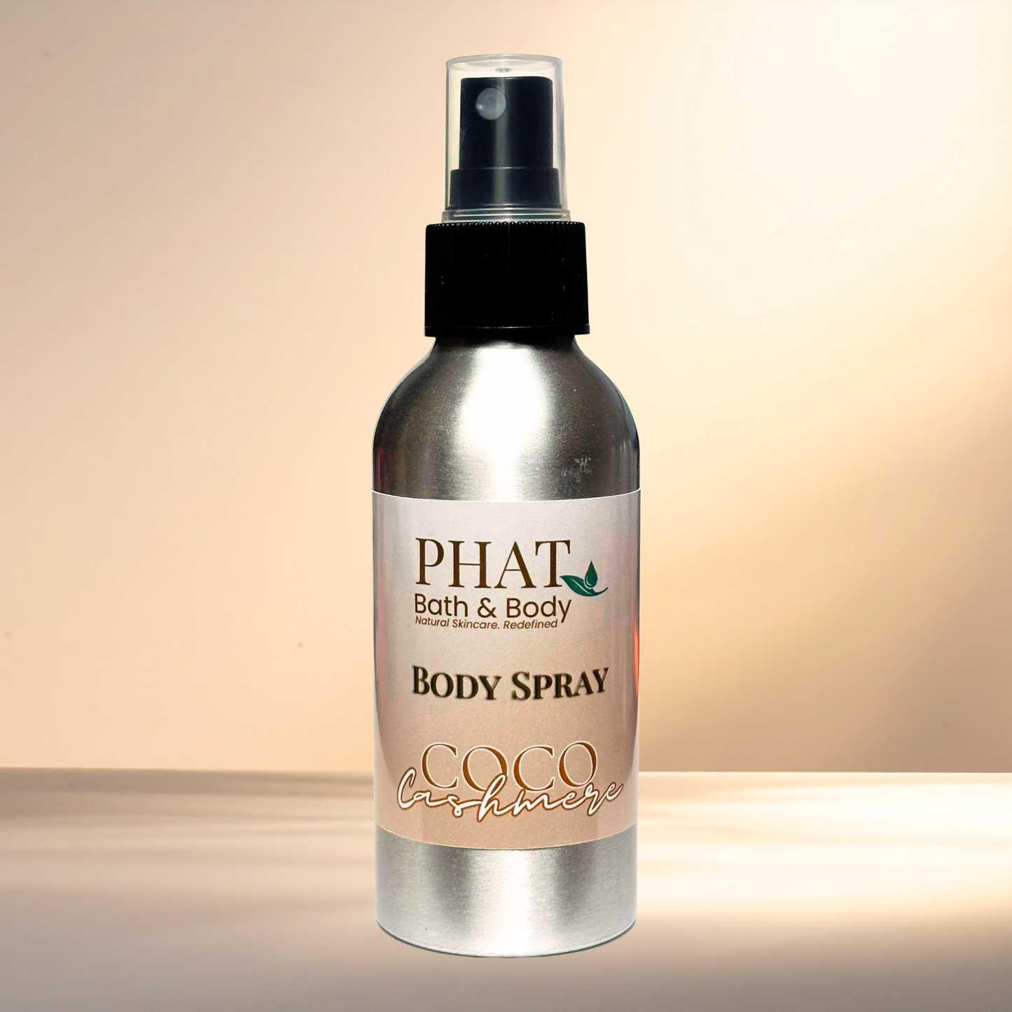 Body spray bottle labeled 'PHAT Bath & Body' on a gradient background