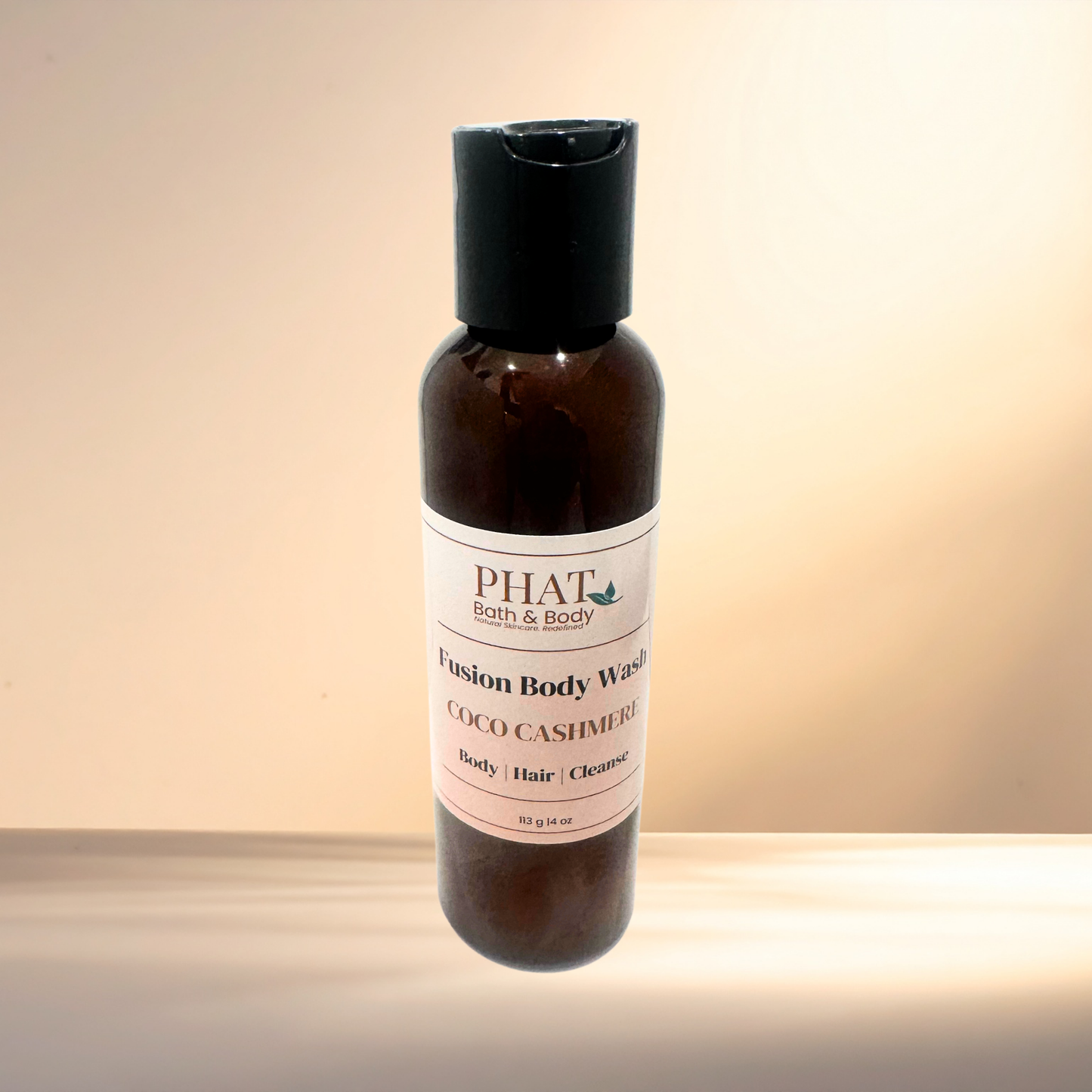 Body wash bottle with 'PHAT Bath & Body' label on a gradient background