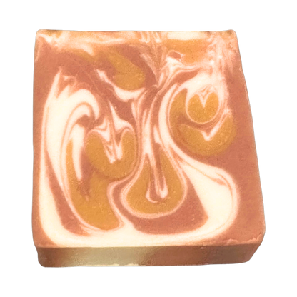 Coco Cashmere handmade clay soap by Phat Bath & Body featuring caramel brown, golden tan, and creamy white marbled swirls on a rectangular bar with a transparent background.