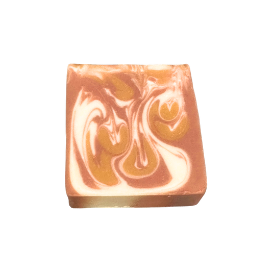 Swirled soap bar with brown and white colors on a white background