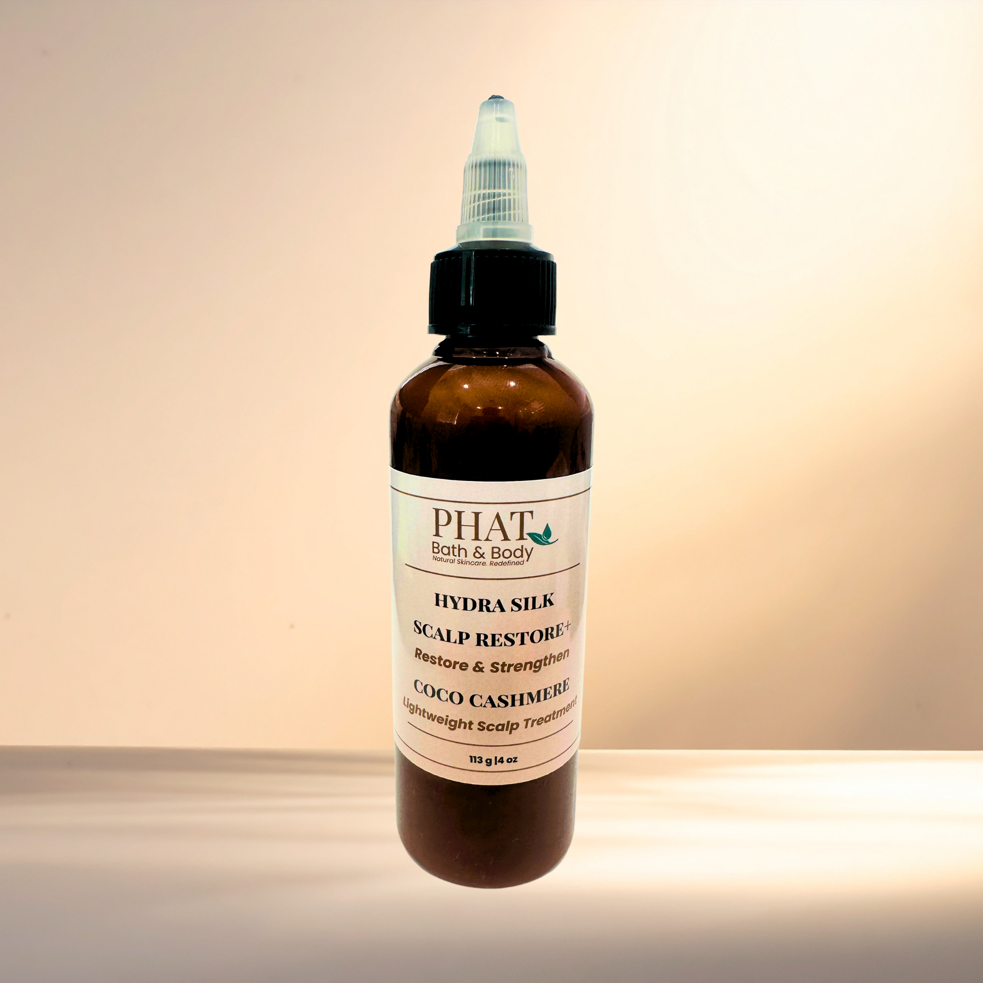 Bottle of PHAT Bath & Body Hydra Silk Scalp Restore product on a gradient background
