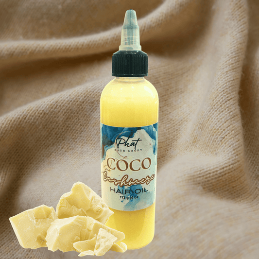 Bottle of Coco Cashmere hair growth oil with a label on a beige cashmere background