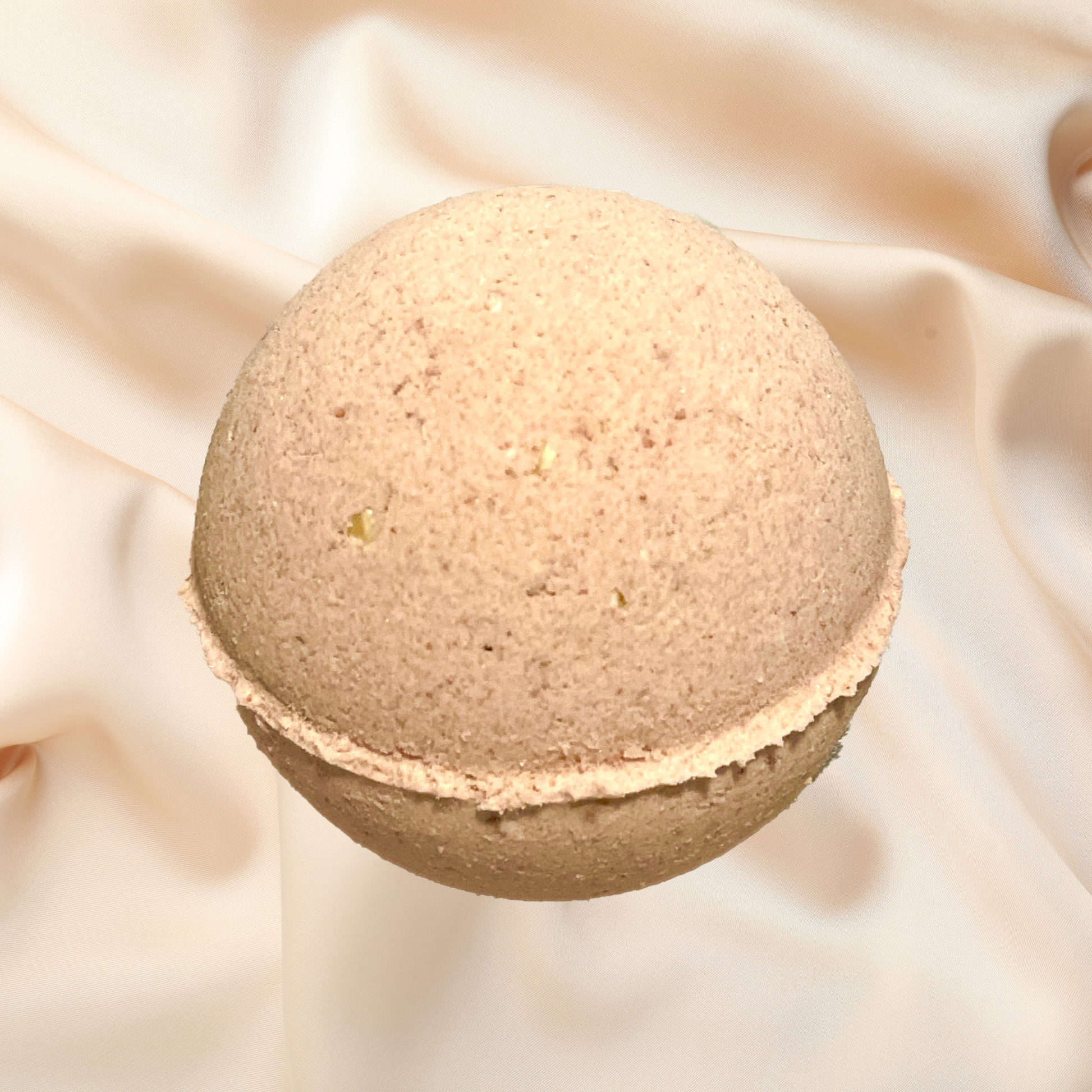 Bath bomb on a soft beige fabric background