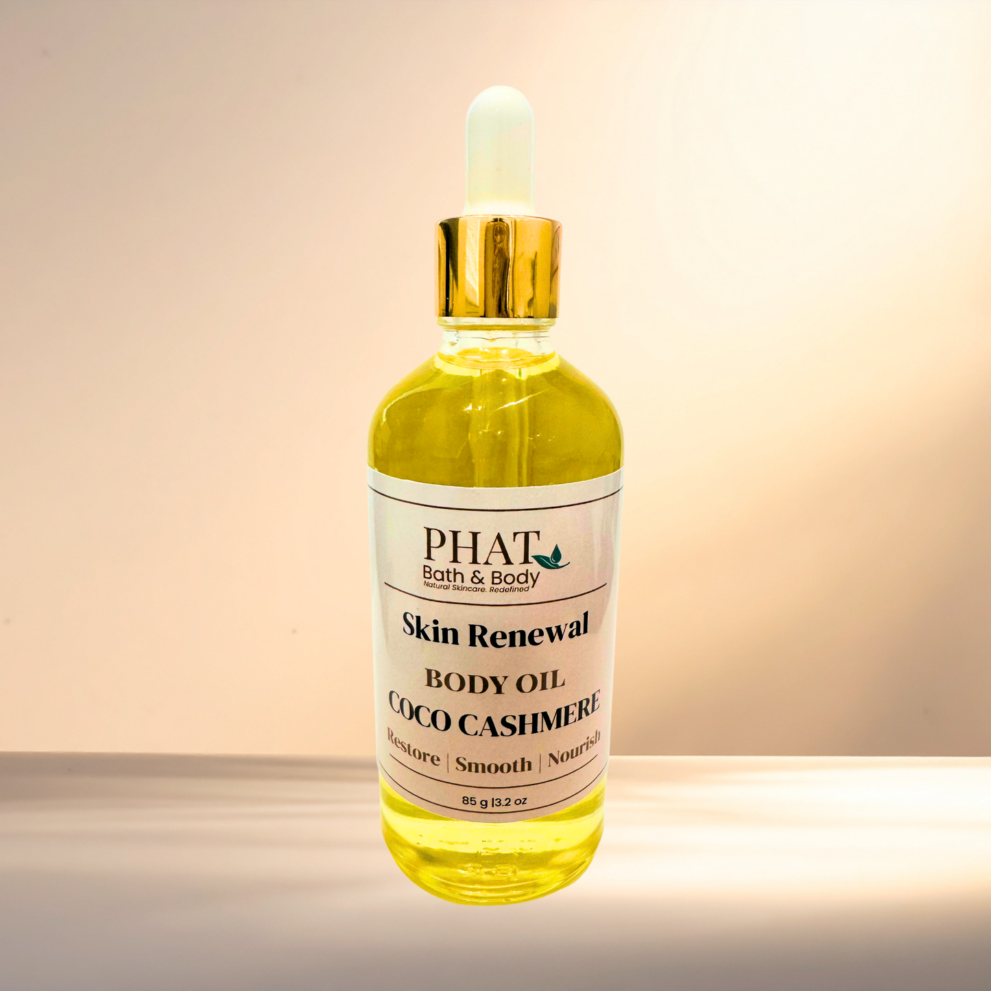 Bottle of PHAT Bath & Body Skin Renewal Body Oil on a gradient background