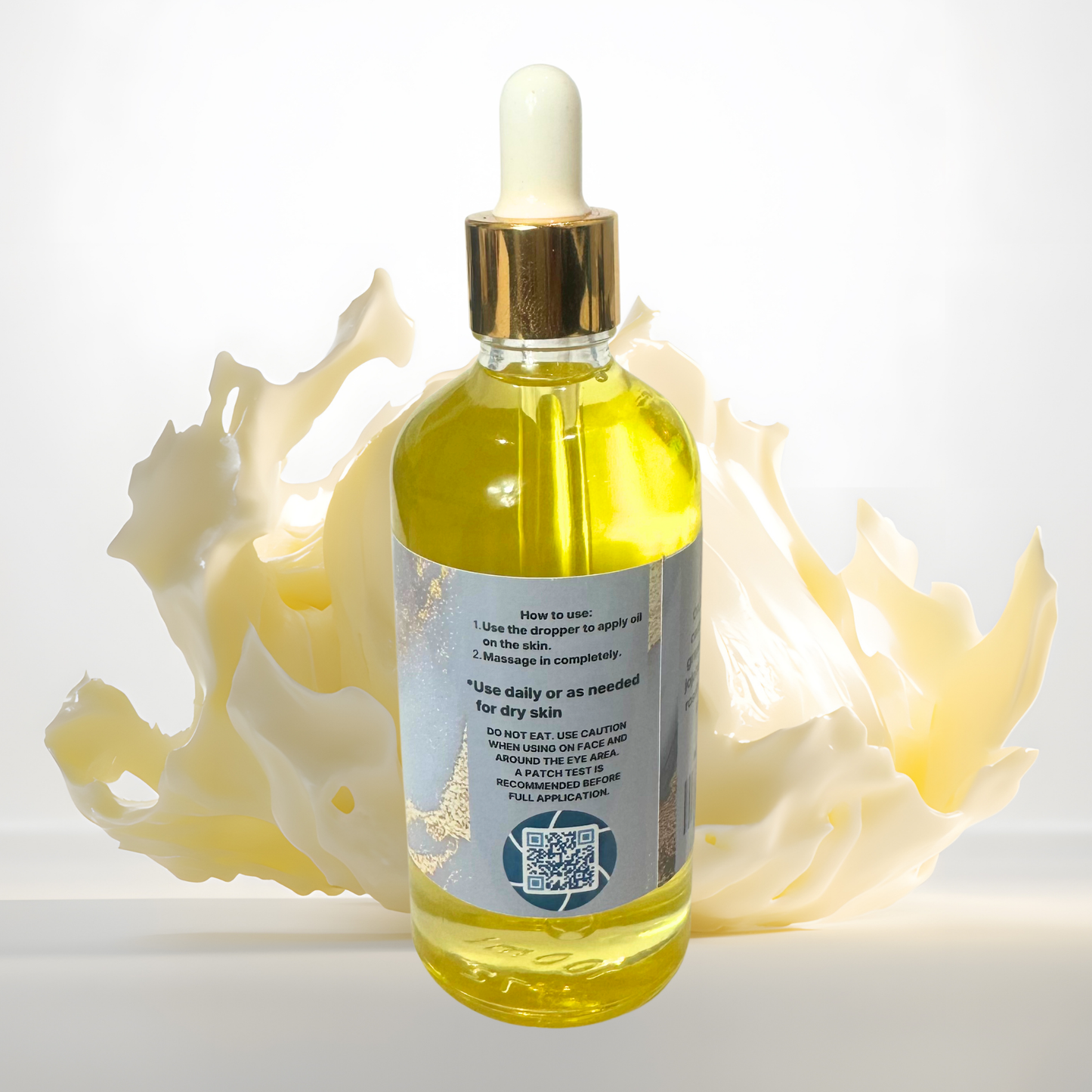 Bottle of body oil with dropper on a white background