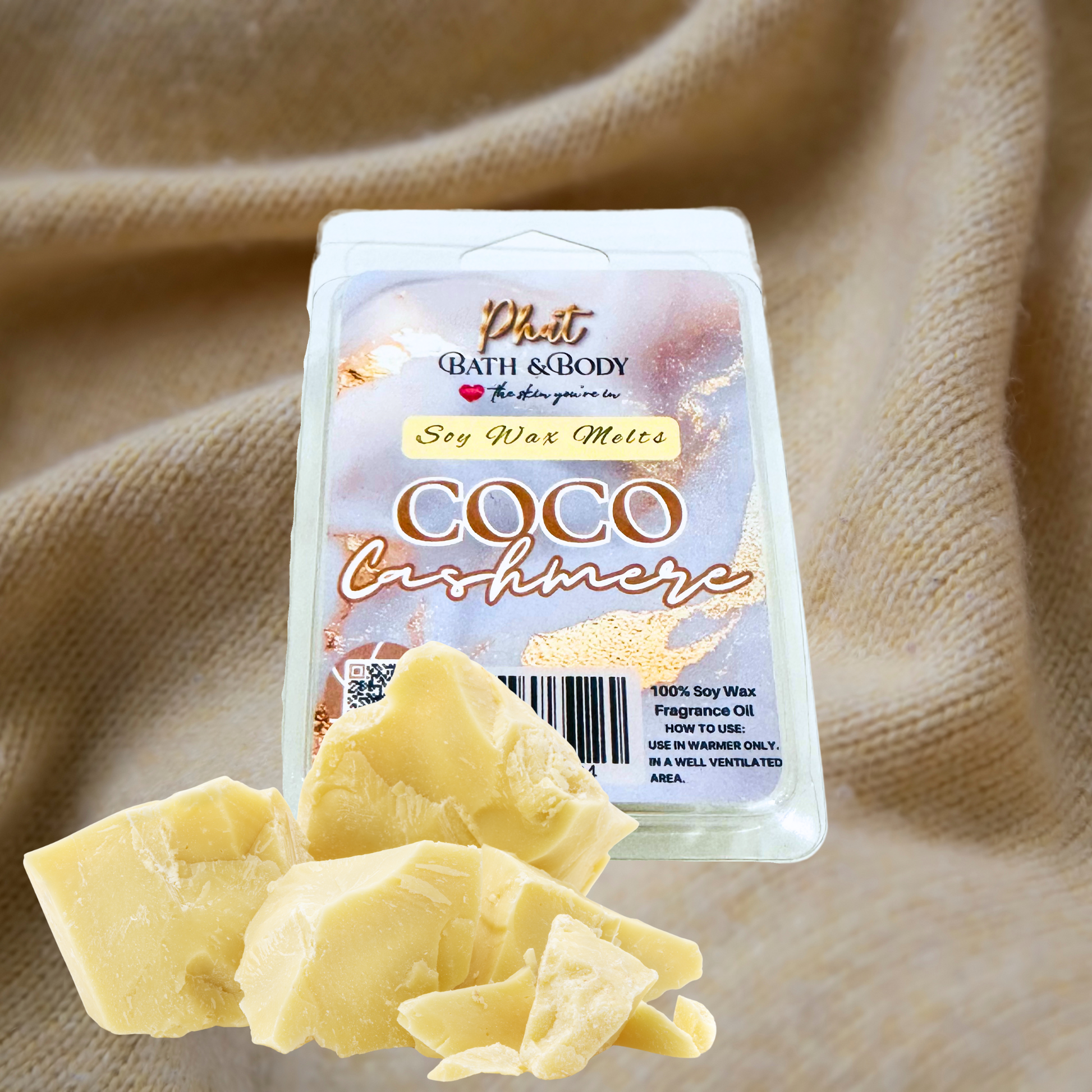 Coco Cashmere soy wax melts packaging with wax pieces on a beige fabric background