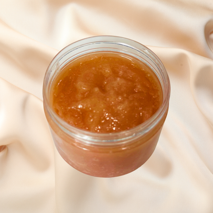 Jar of brown scrub on a beige fabric background