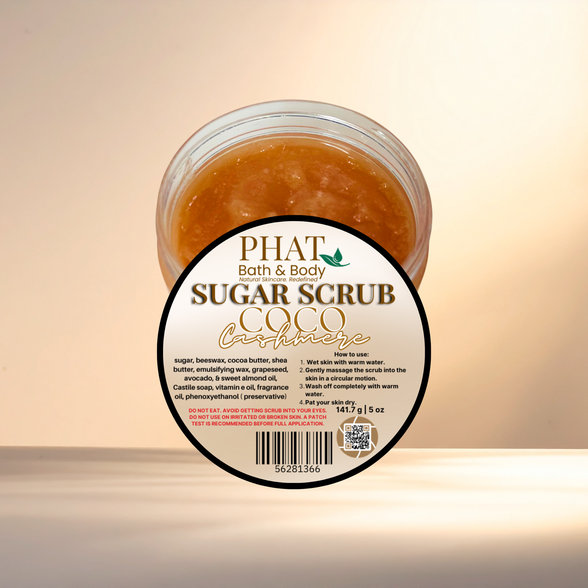 Jar of sugar scrub with a label on a light background