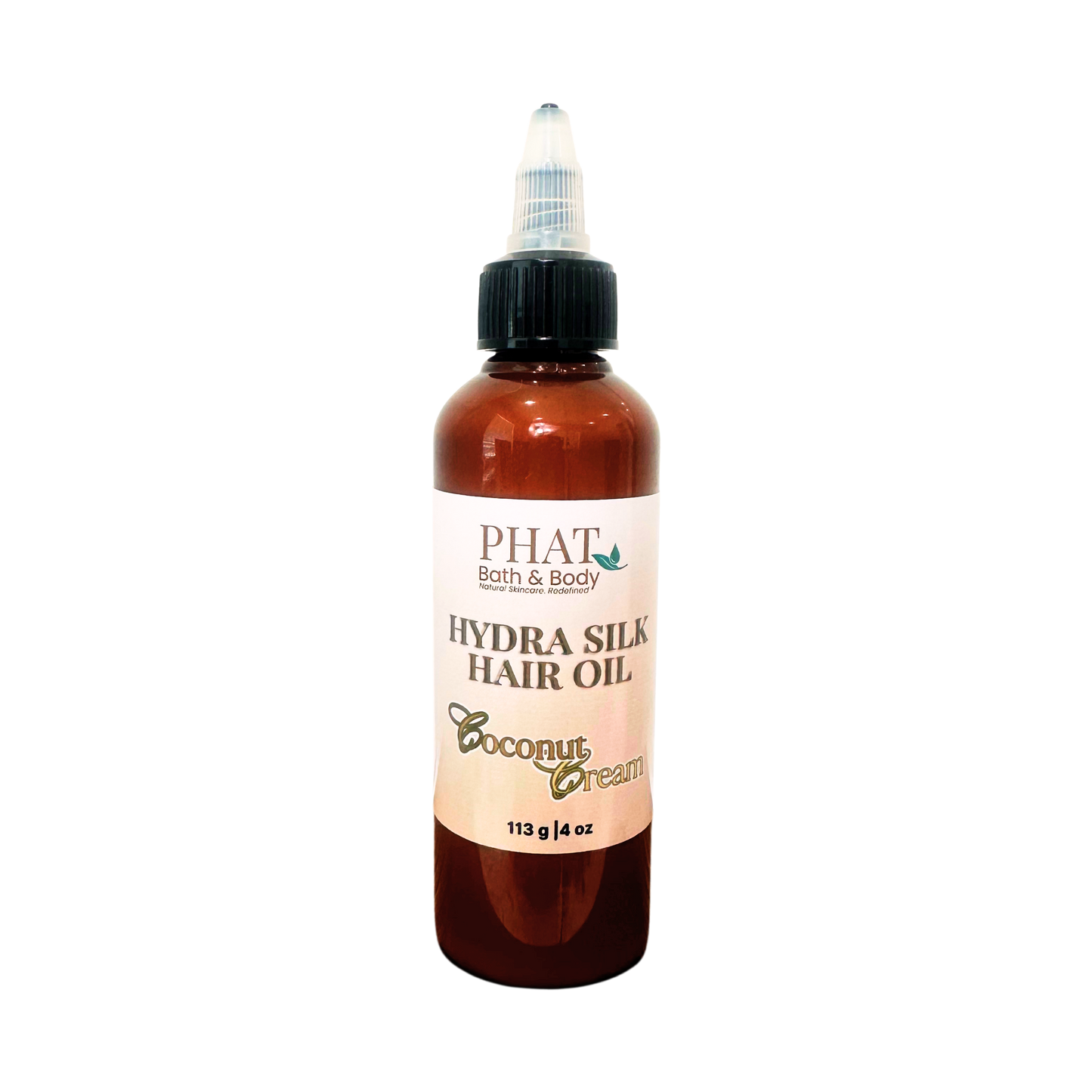 A bottle of PHAT Bath & Body  Hydra Silk Hair Oil in Coconut Cream scent, featuring an amber brown bottle, black cap, and a cream-colored label.