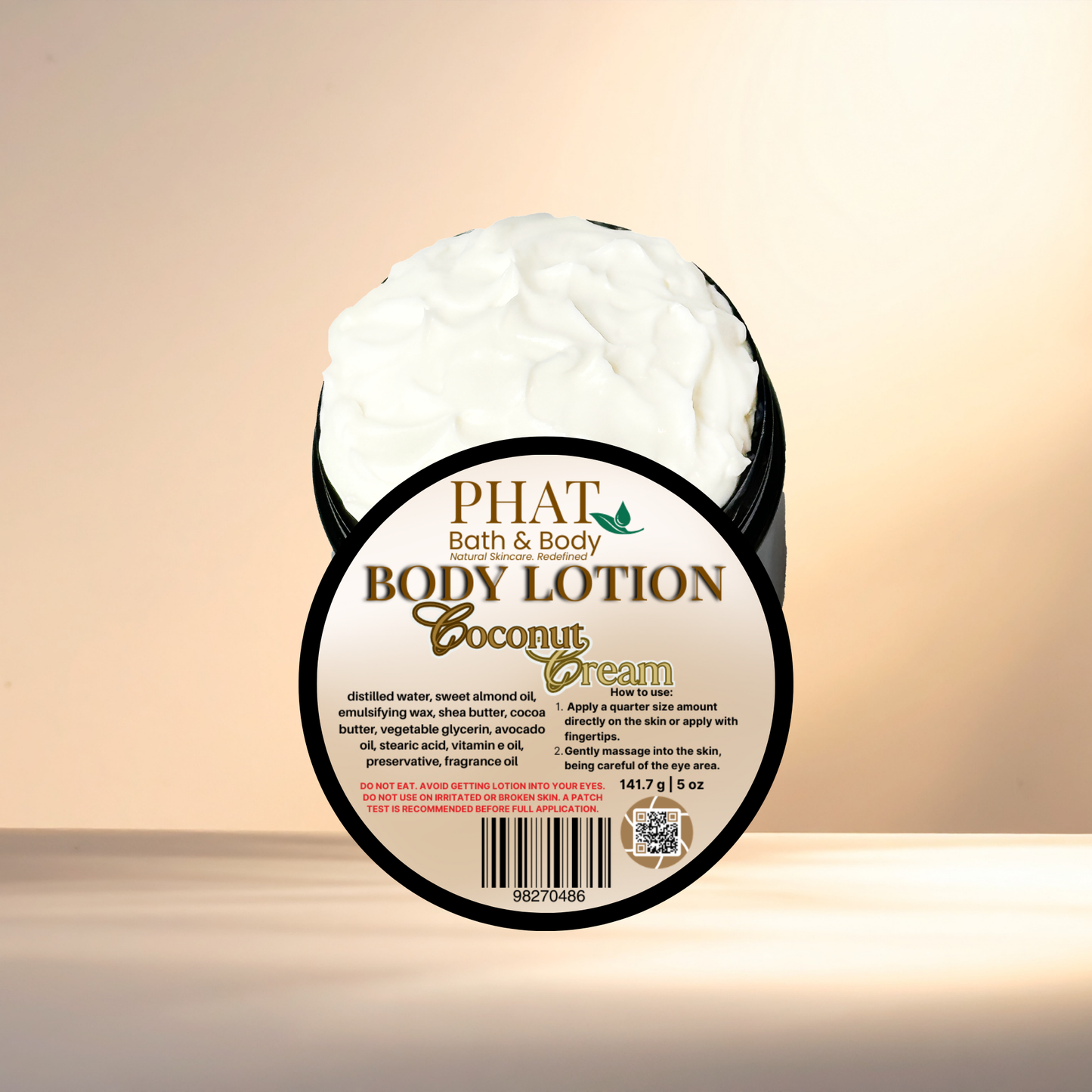 Body lotion container labeled 'Coconut Cream' by 'PHAT Bath & Body' on a gradient background