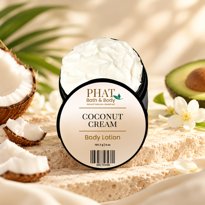 Phat Bath & Body Coconut Cream Body Lotion styled with fresh coconut, avocado, white tropical flowers, soft neutral fabric, and warm natural stone.