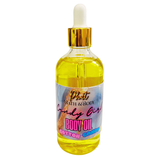 Bottle of body oil with a dropper labeled 'Candy Girl' on a white background