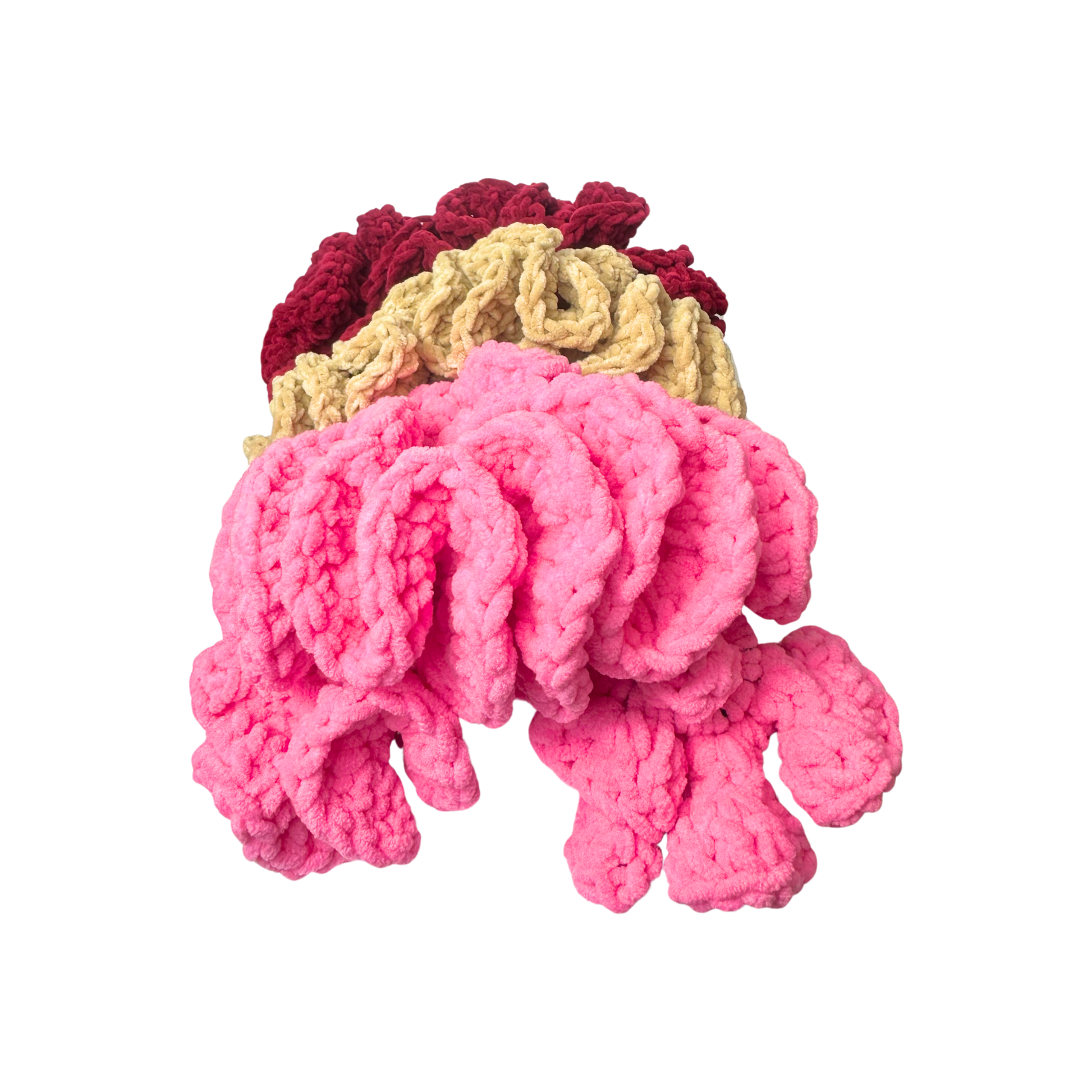 Crocheted headbands with pink, tan, and red colors on a white background