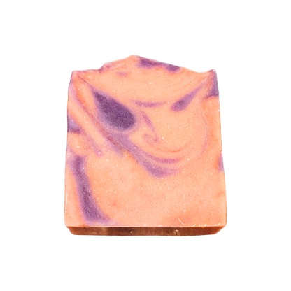 Bar of soap with pink and purple swirls on a white background