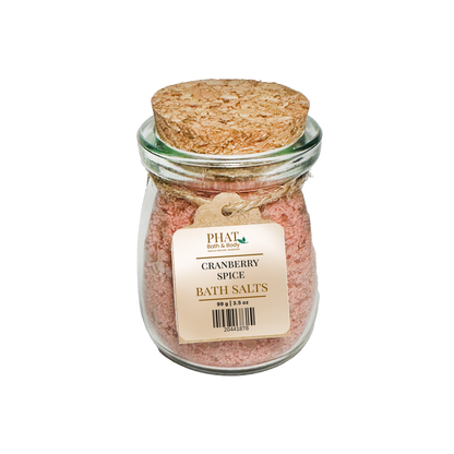 Jar of Cranberry Spice Bath Salts with cork lid on a white background