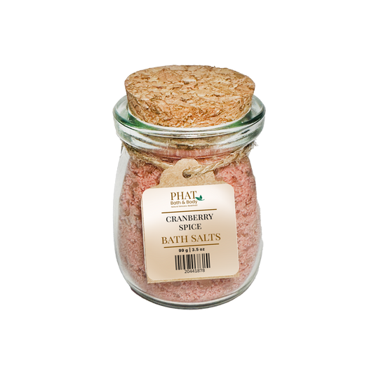 Jar of Cranberry Spice Bath Salts with cork lid on a white background