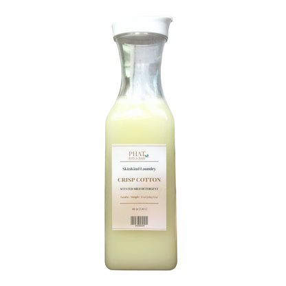 Bottle of Phat Bath & Body Skinkind Laundry Crisp Cotton detergent on a white background