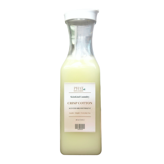Bottle of Phat Bath & Body Skinkind Laundry Crisp Cotton detergent on a white background