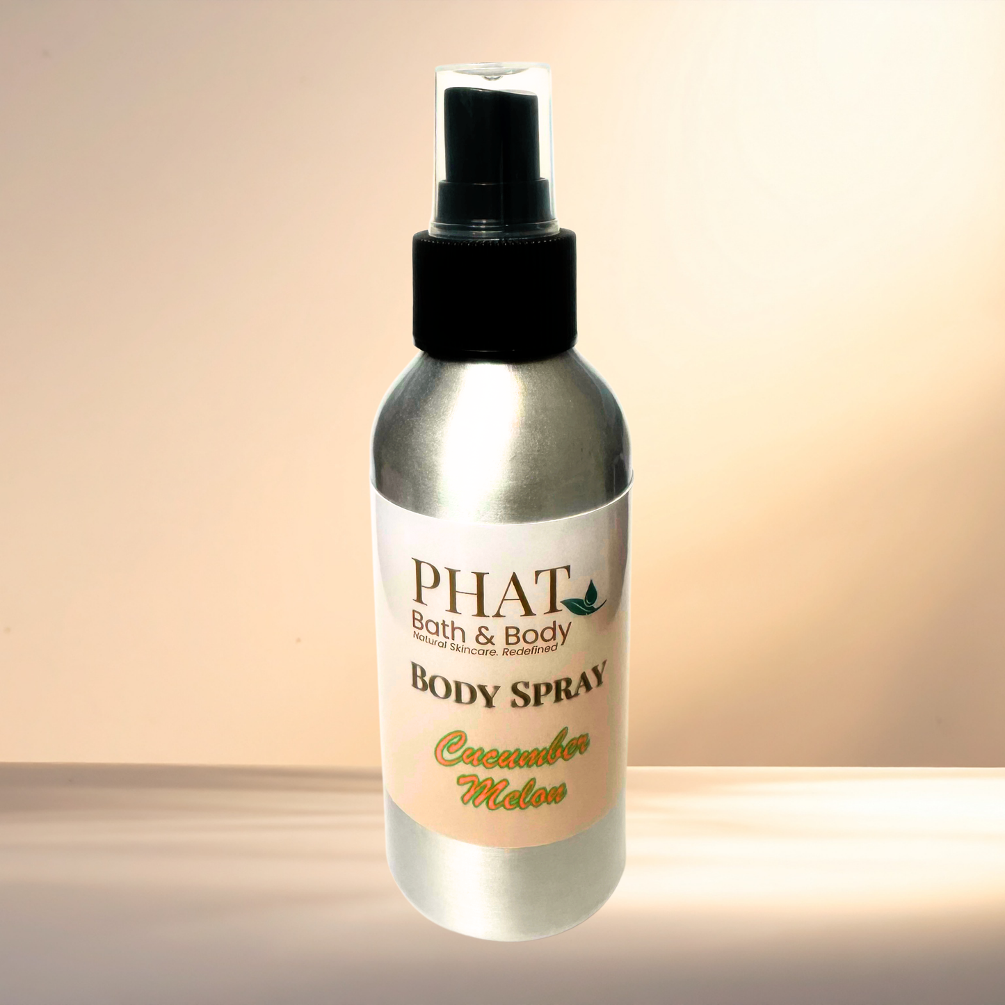 Body spray bottle labeled 'PHAT Bath & Body' on a gradient background