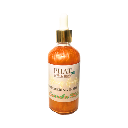Bottle of 'Cucumber Melon' shimmering body oil from Phat Bath & Body on a white background