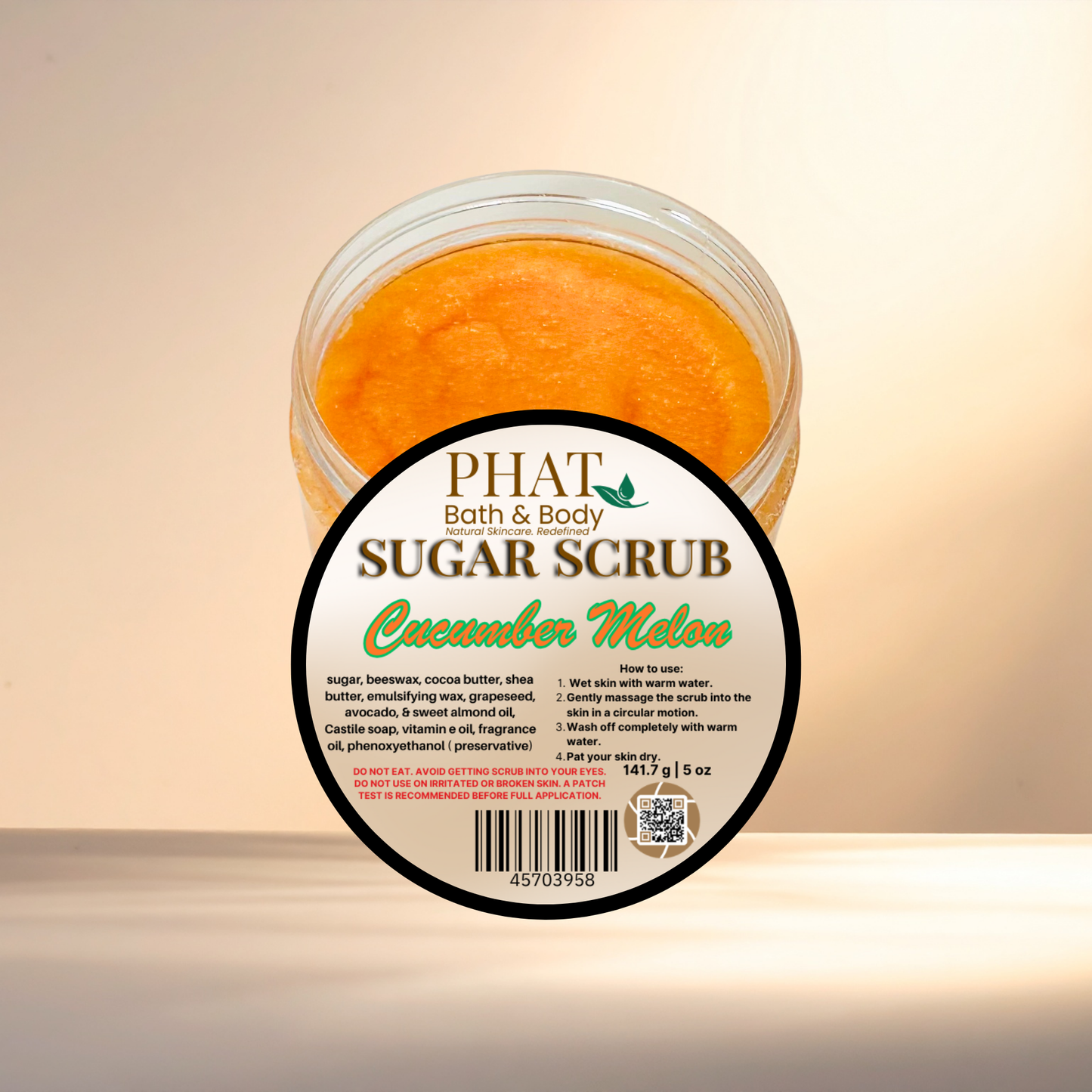 Jar of Phat Bath & Body Cucumber Melon sugar scrub on a beige background