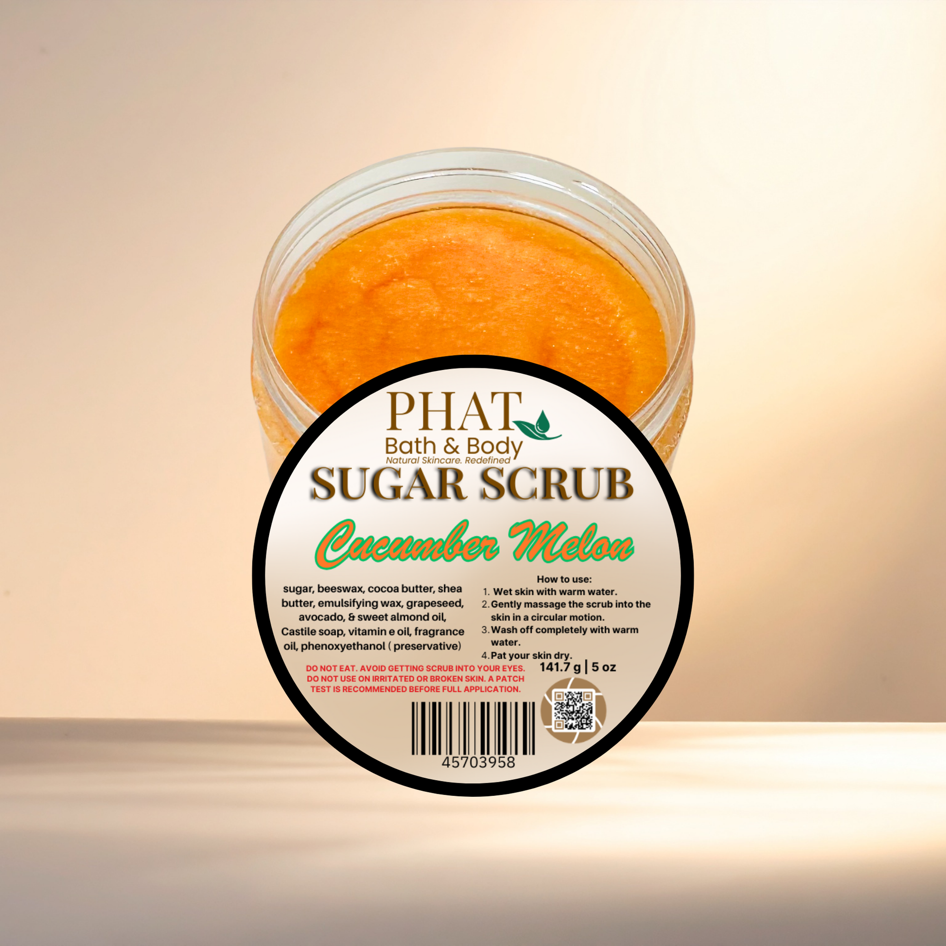 Jar of Phat Bath & Body Cucumber Melon sugar scrub on a beige background