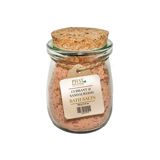 Jar of Currant & Sandalwood Bath Salts with cork lid on a white background