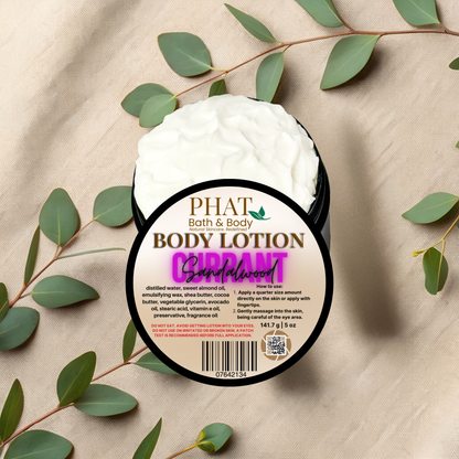 Body lotion container with 'Phat Bath & Body' branding on a beige fabric background with green leaves.